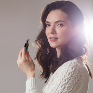 lady holding a fragrance product